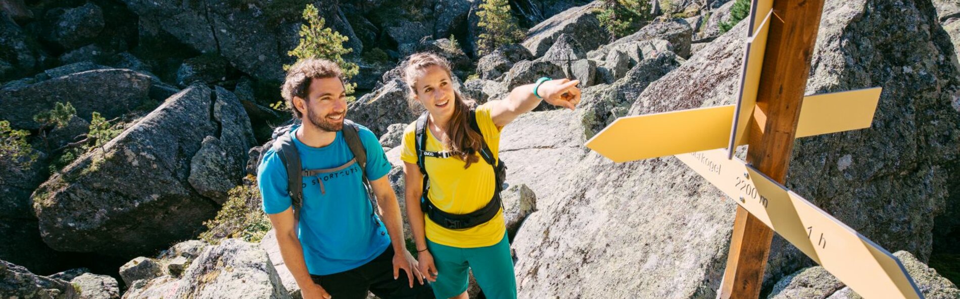 Signposts; blocked terrain; two people