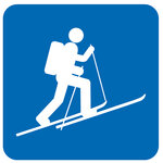 Blue icon of a ski tourer.