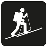 Black icon of a ski tourer.