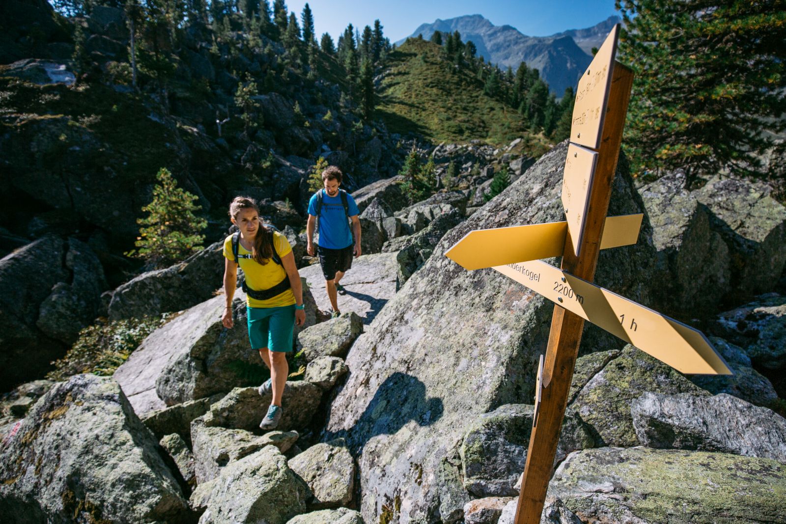 blocked terrain; signposts; two hikers